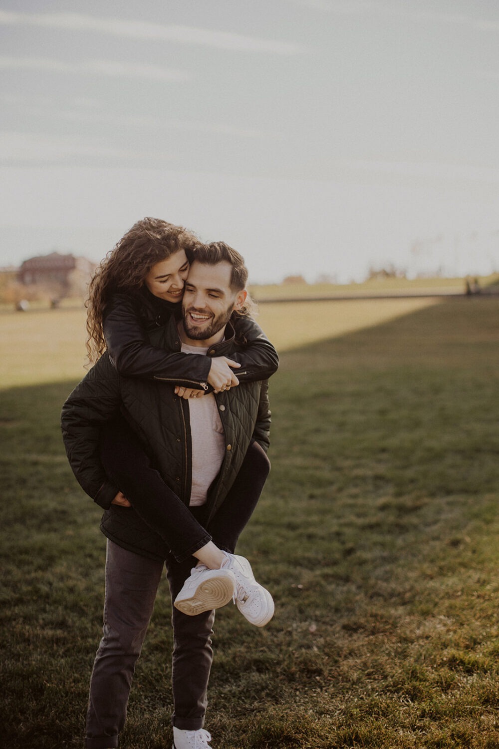 couple embraces at Washingtion DC outdoor engagement session