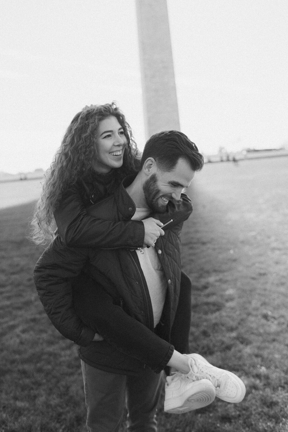 couple embraces at Washingtion DC outdoor engagement session