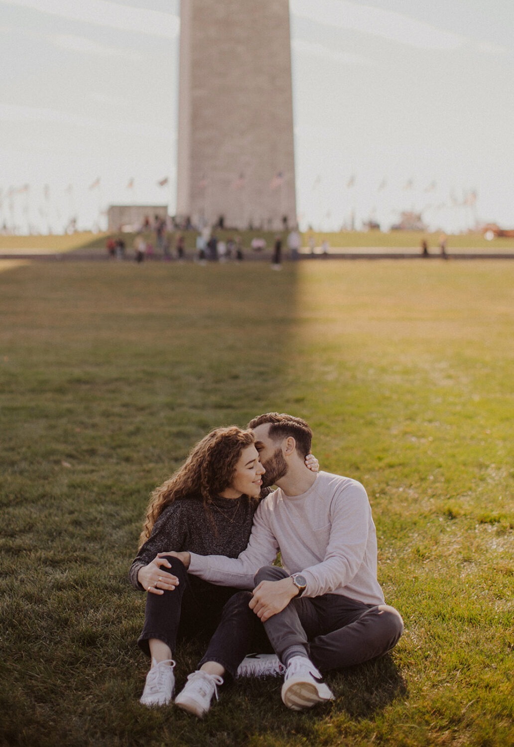 couple kisses at Washingtion DC outdoor engagement session