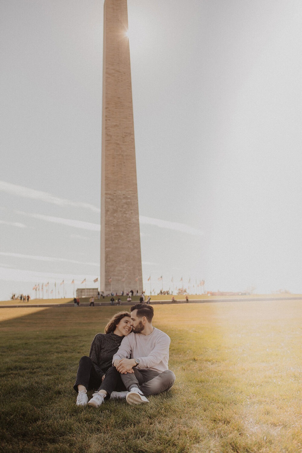 couple embraces at Washingtion DC outdoor engagement session