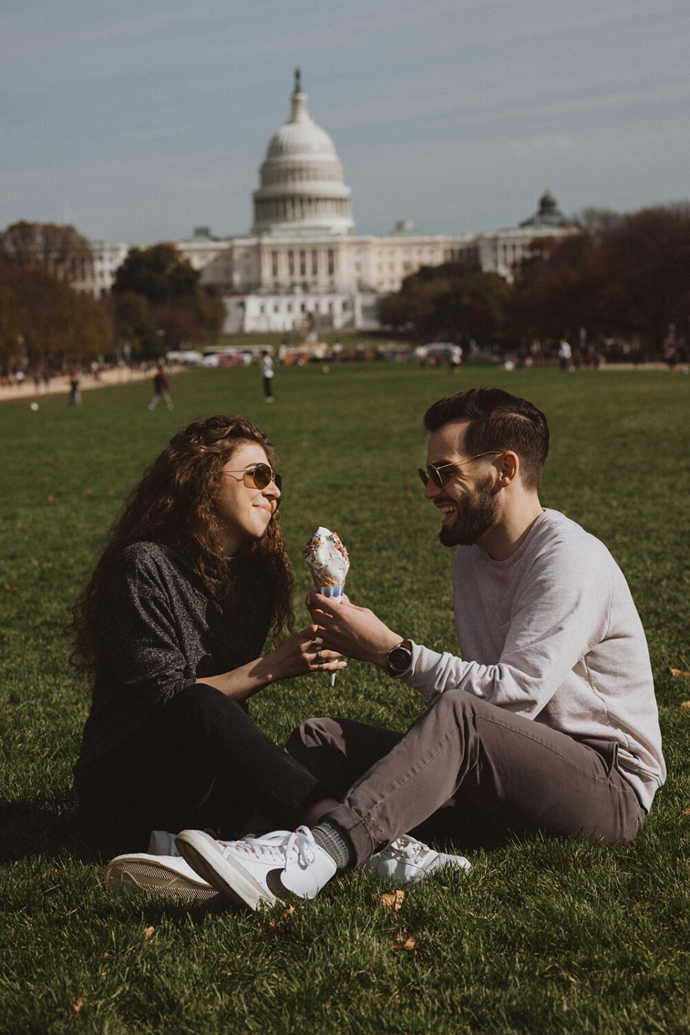 couple eats ice cream at outdoor DC engagement session