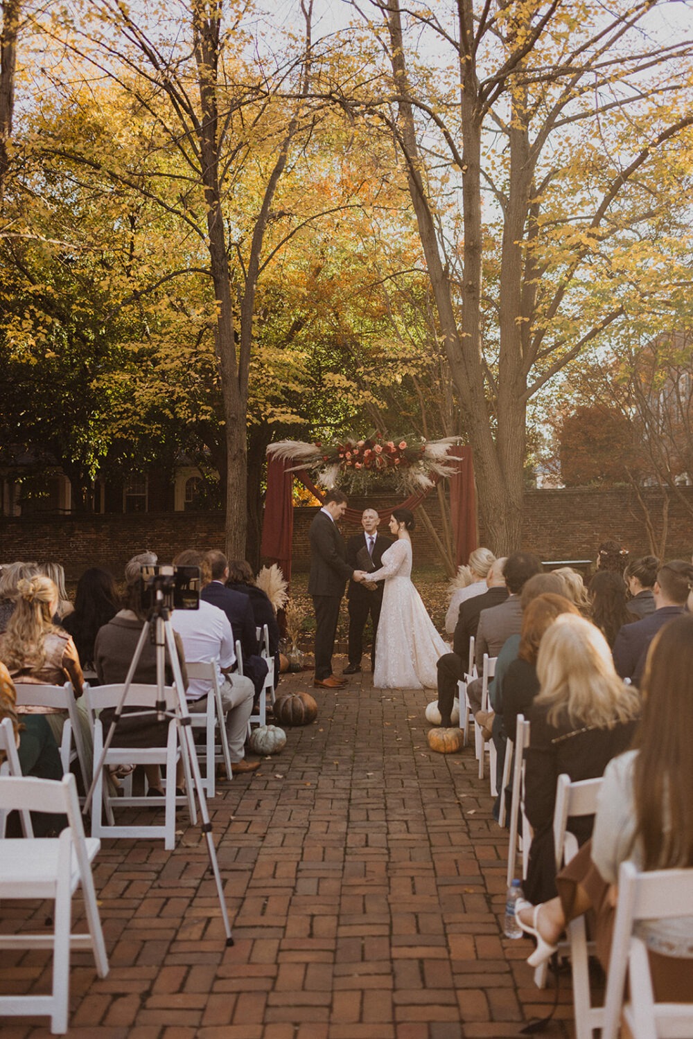 couple exchanges vows at outdoor wedding ceremony