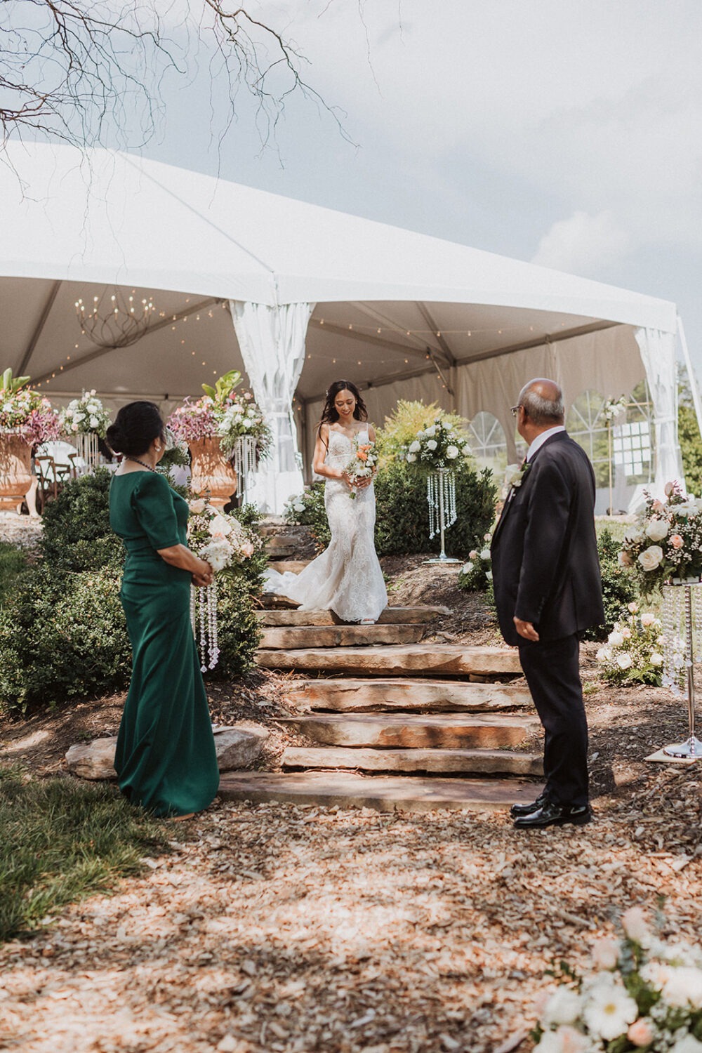 bride walks down aisle with parents