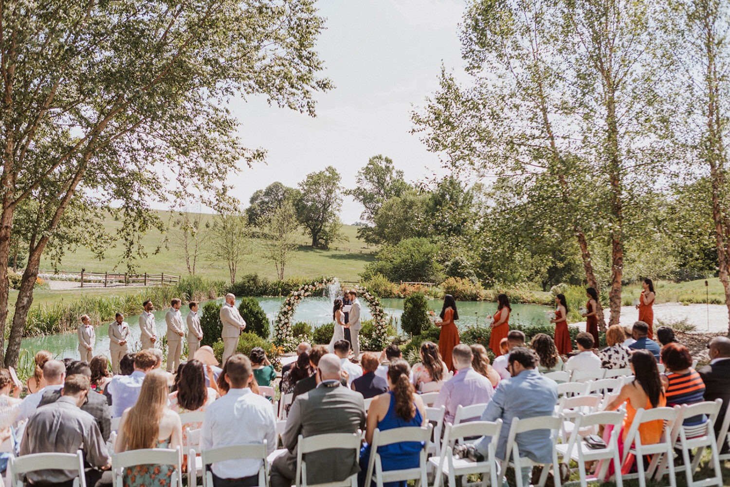 couple exchanges vows at outdoor wedding 