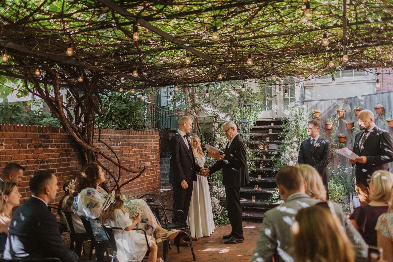 couple exchanges vows at outdoor wedding ceremony