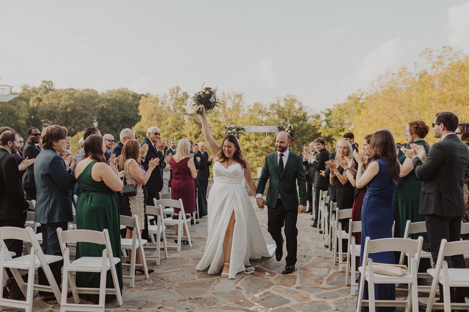 couple exits wedding at outdoor wedding ceremony
