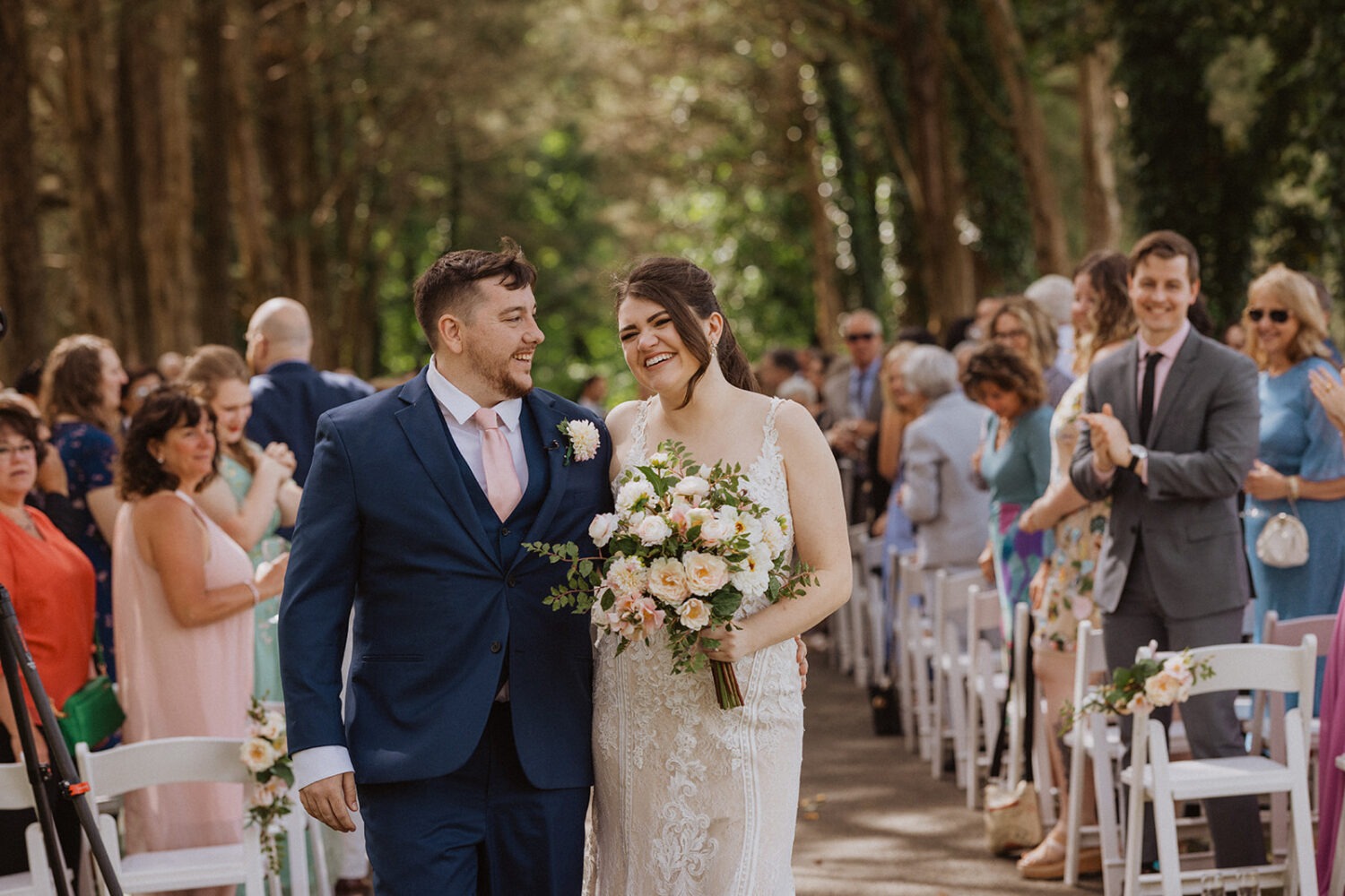 couple exits wedding at outdoor wedding ceremony