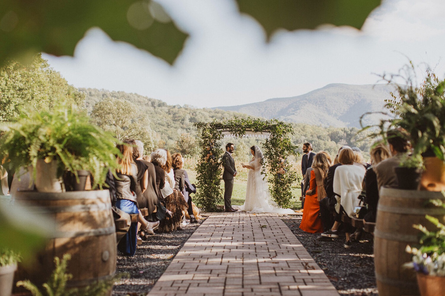 couple exchanges vows at outdoor wedding ceremony