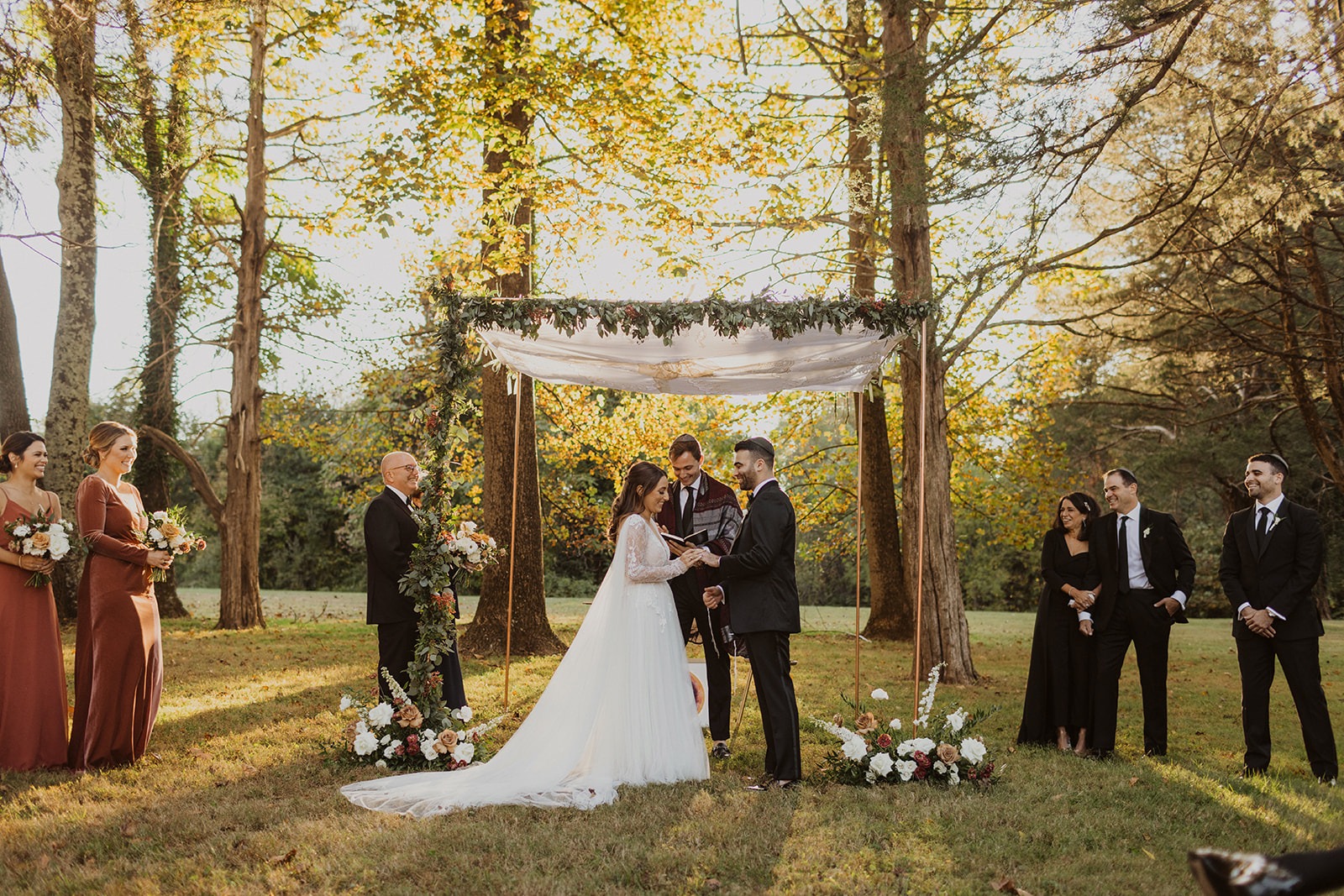 couple exchanges vows during outdoor wedding ceremony