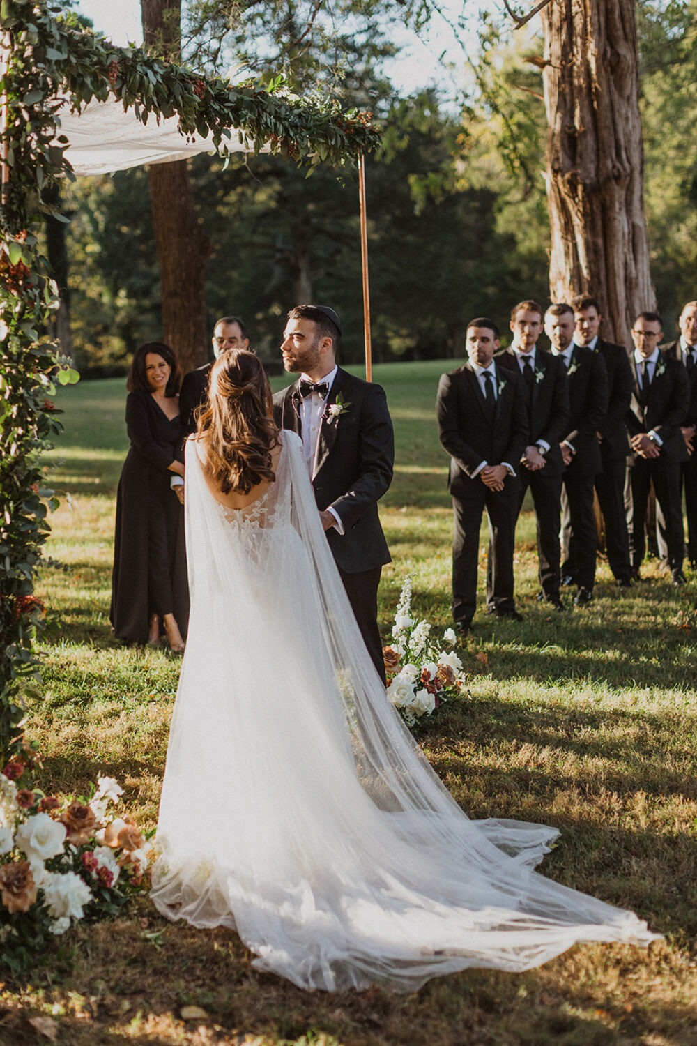 couple exchanges vows at outdoor wedding ceremony