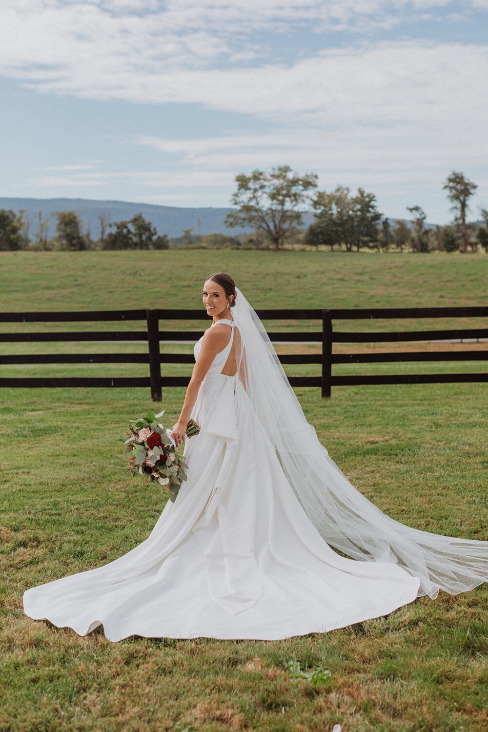 bride poses with wedding bouquet 