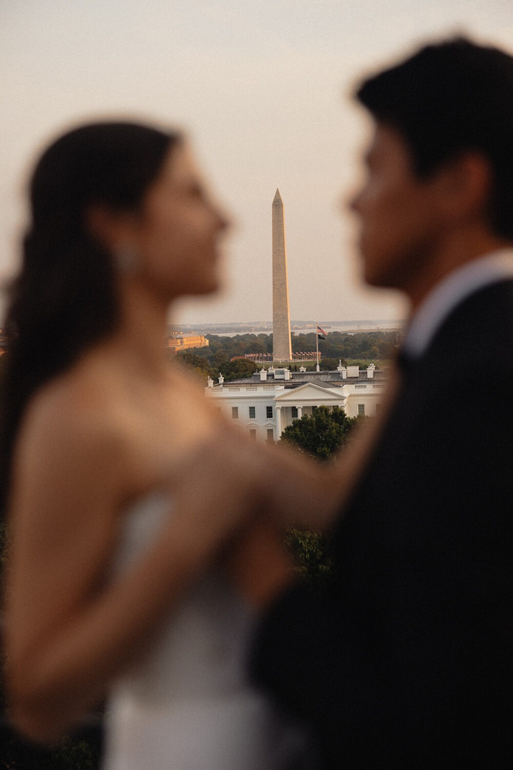 couple kisses on rooftop at The Hay-Adams hotel