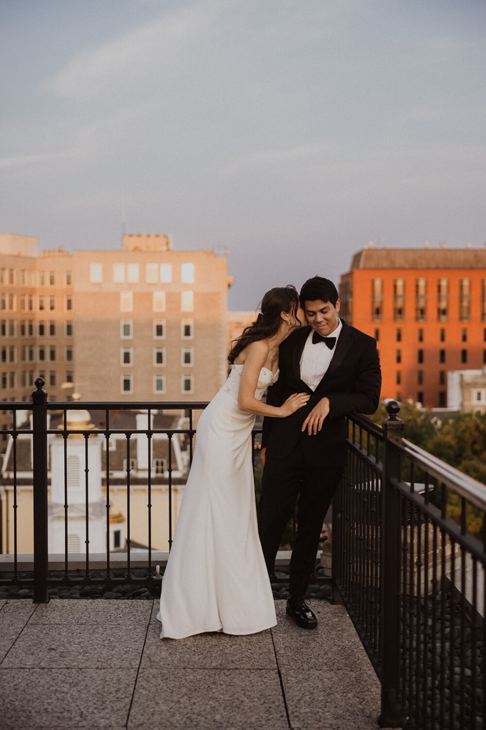 couple kisses on rooftop at The Hay-Adams hotel