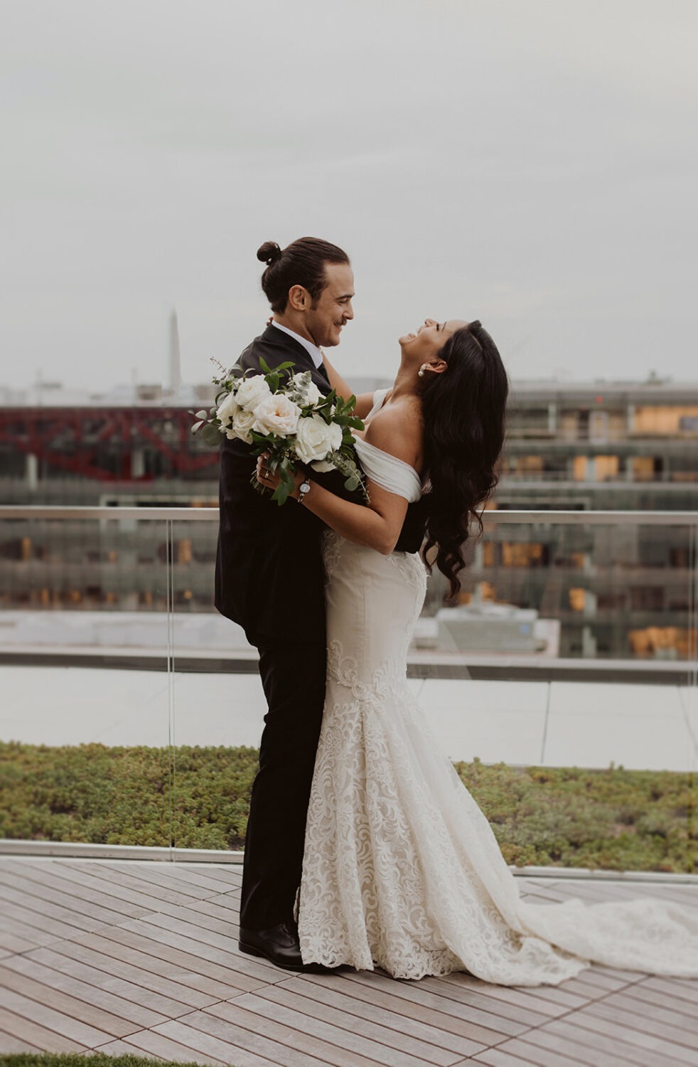 couple laughs at their DC rooftop venue