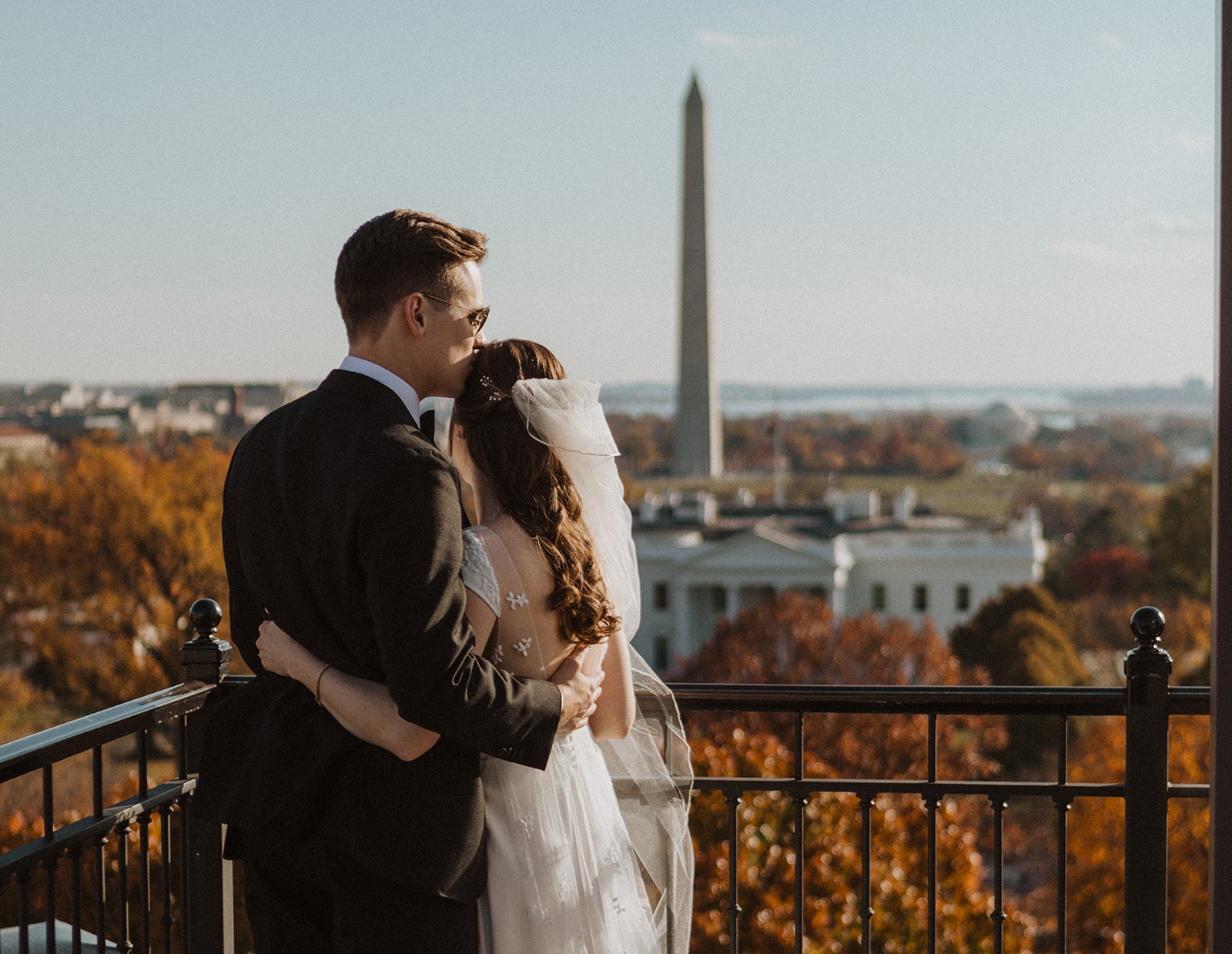 couple kisses on top of DC rooftop venue