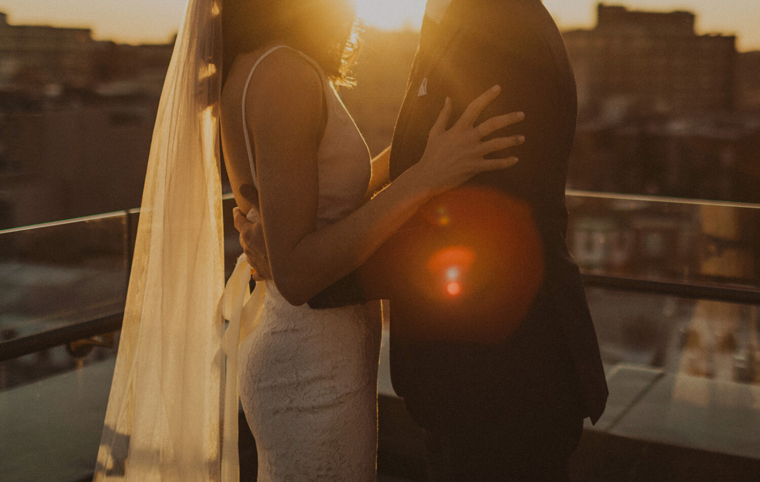 couple embraces at rooftop venues in DC perfect for an elopement