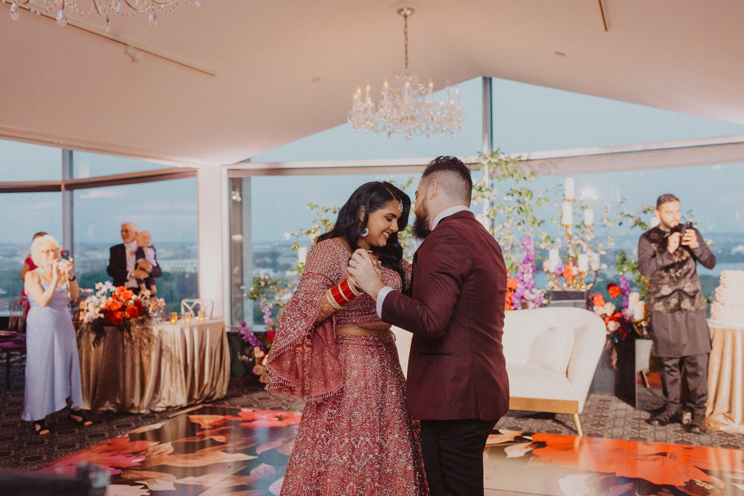 couple dances during reception at rooftop venue