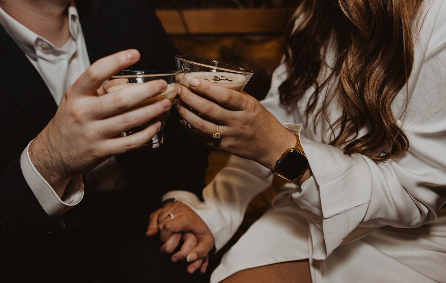 couple drinks cocktails at winter engagement photoshoot