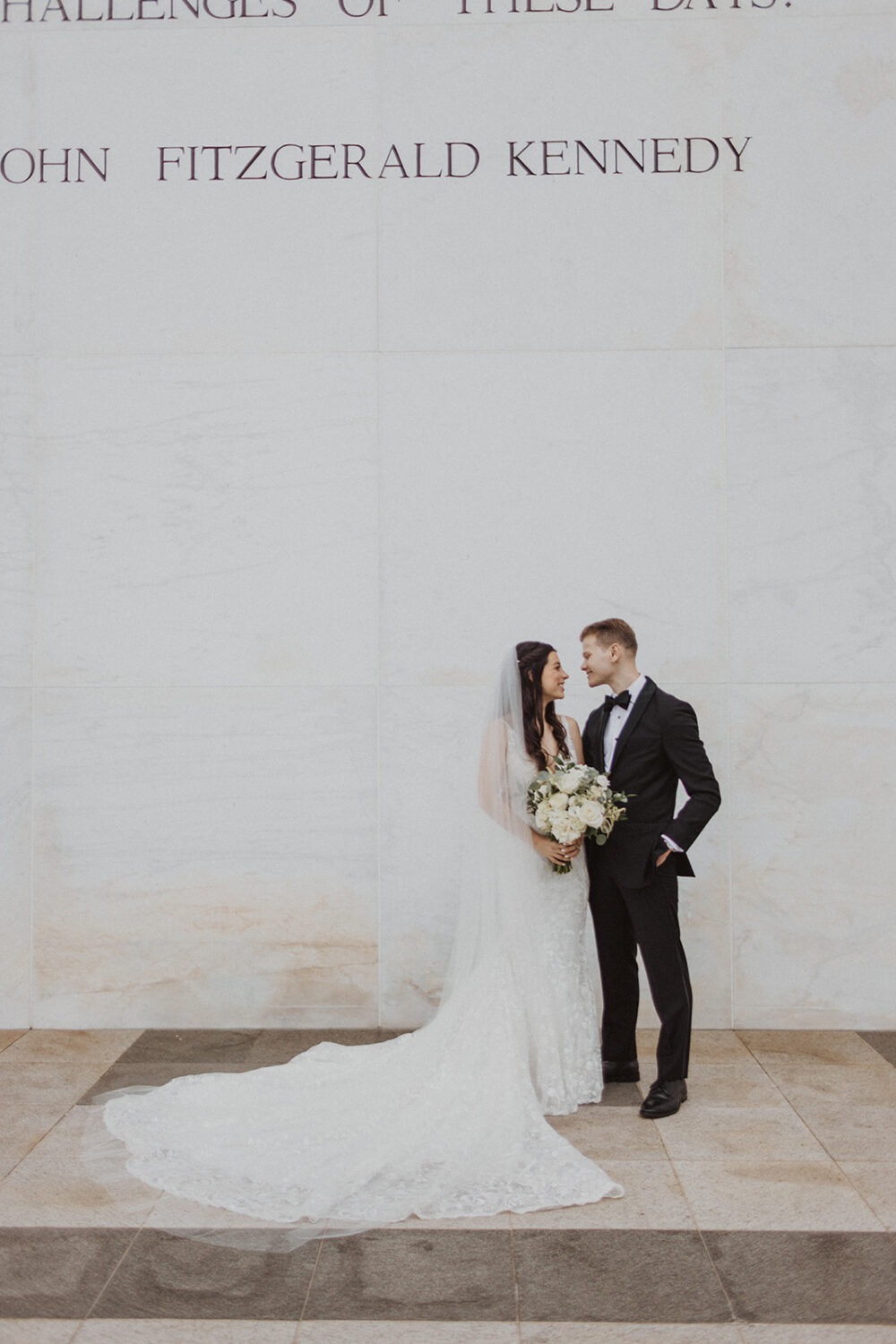 couple poses at Kennedy Center Washington DC elopement