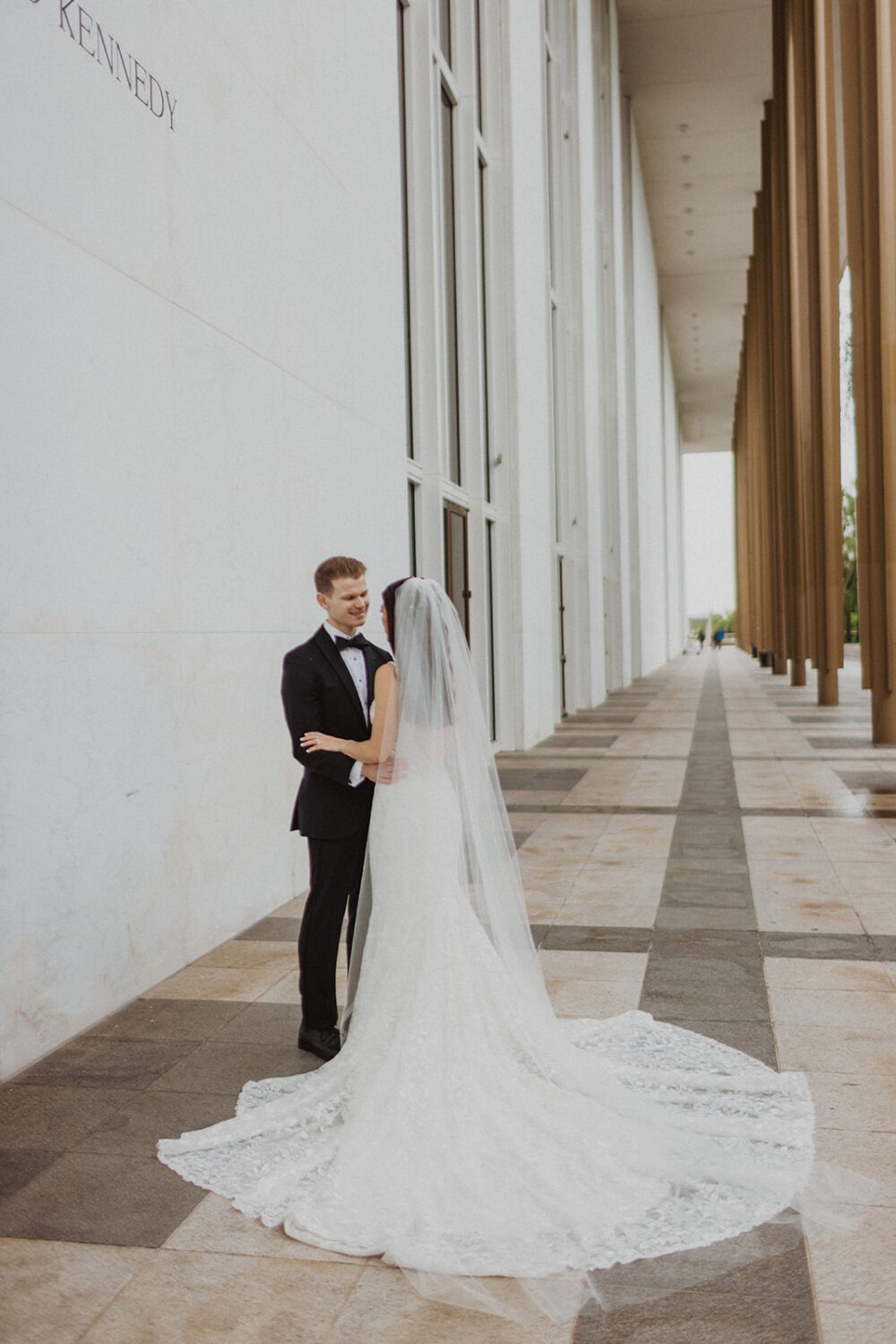 couple poses at Kennedy Center DC outdoor elopement