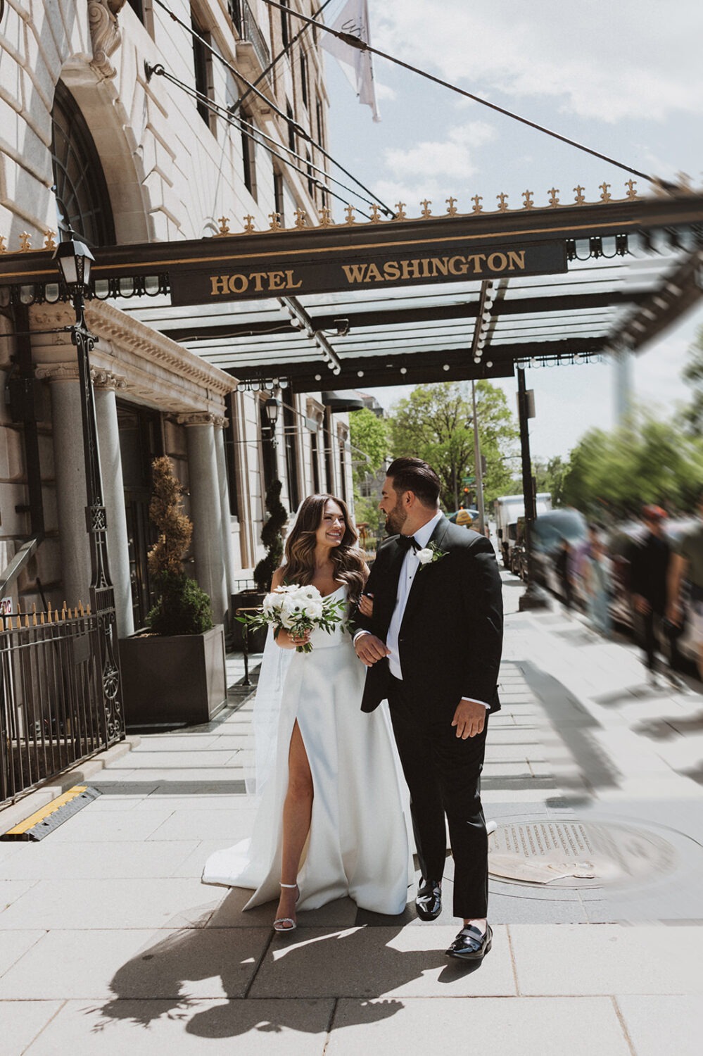 wedding couple walks along Washington DC city streets