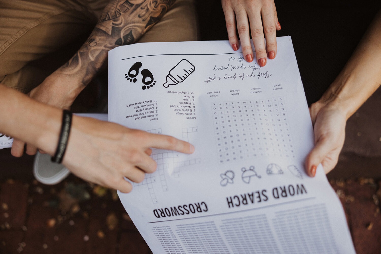 Couple goes through baby announcement word search