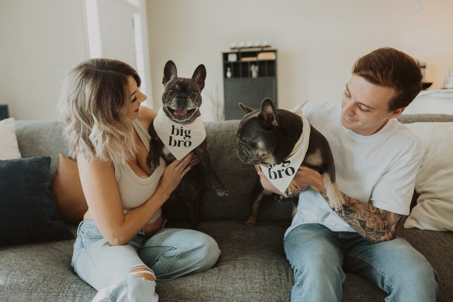 Couple poses with their dogs during their couples maternity session