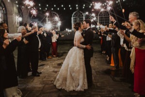couple kisses under sparkler exit