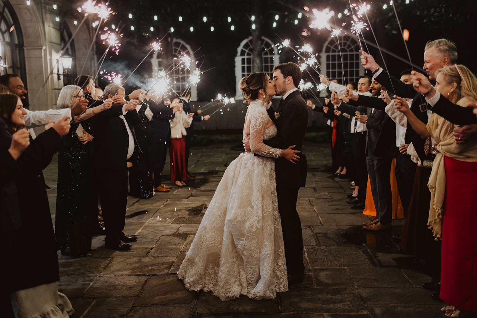 couple kisses under sparkler exit