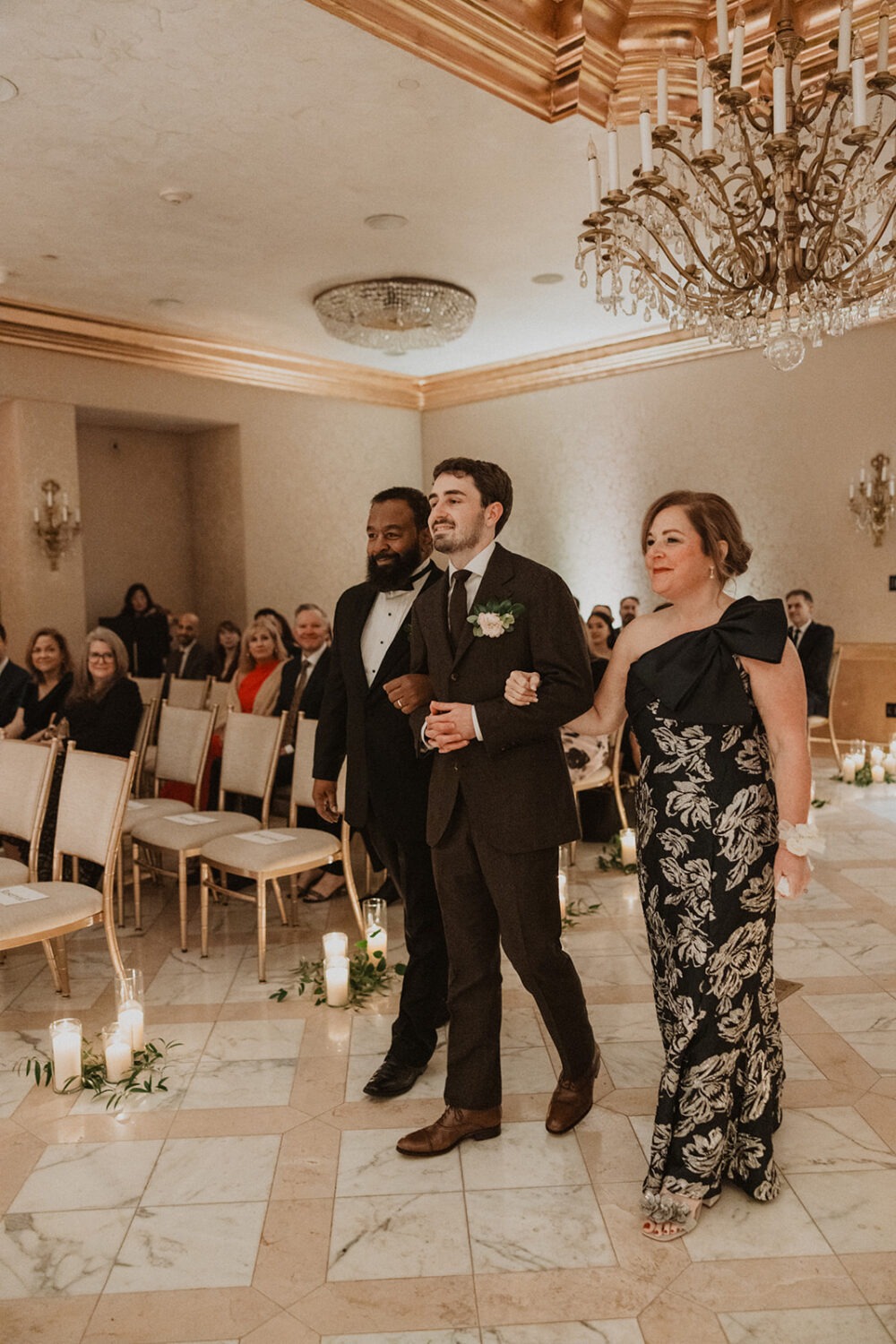 group walks down aisle with parents at St. Regis DC hotel wedding