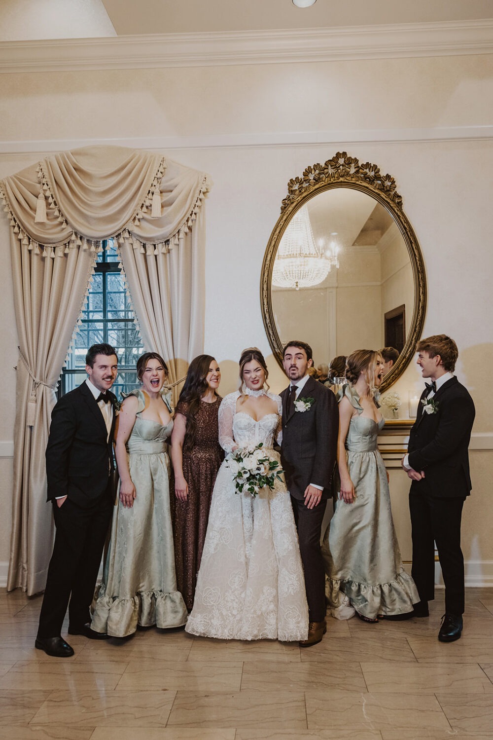 wedding party makes funny faces together