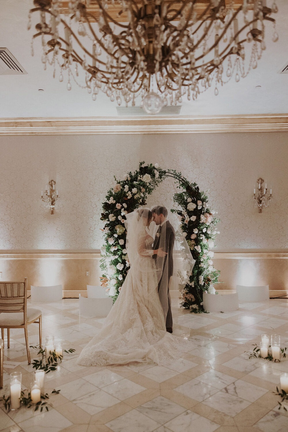 couple embraces under veil at St. Regis DC hotel