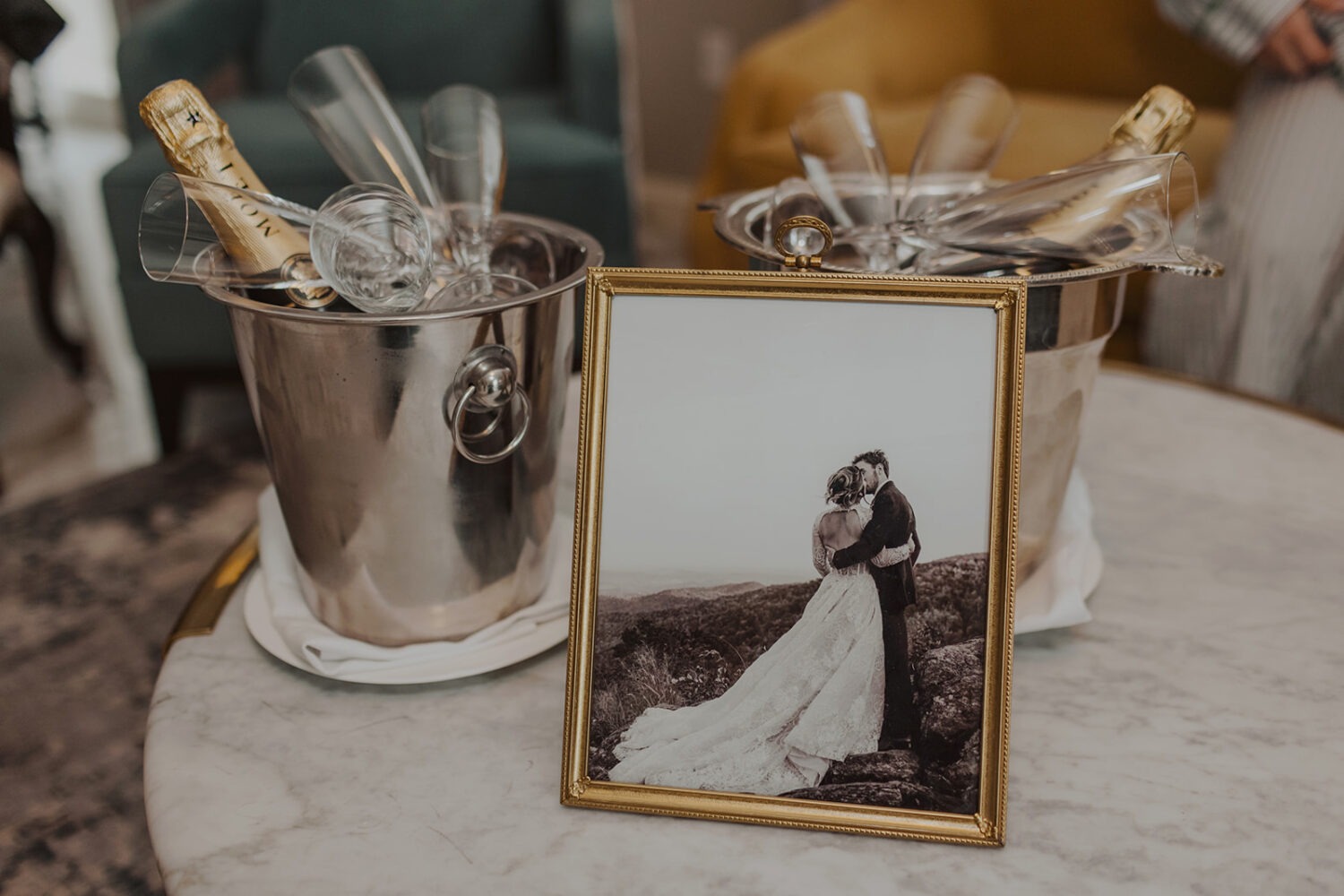 framed photo of couple beside champagne