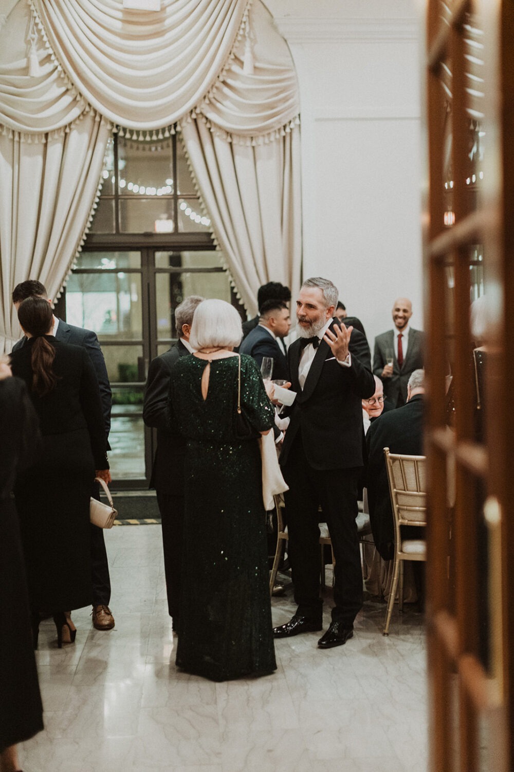 guests mingle at wedding cocktail hour at St. Regis DC hotel