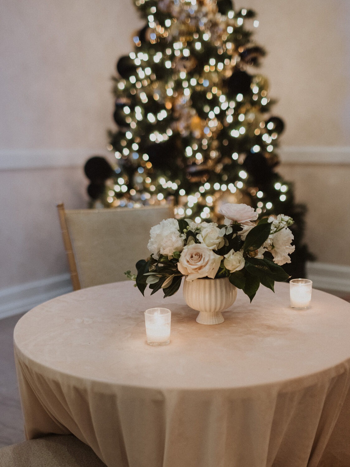 wedding florals in front of Christmas tree