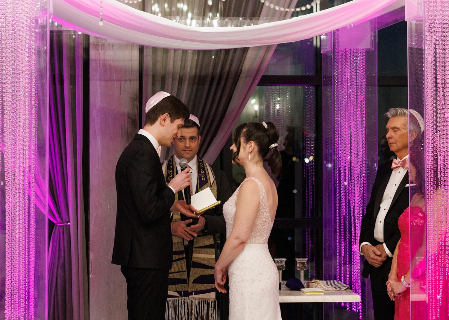 couple reciting vows during wedding ceremony