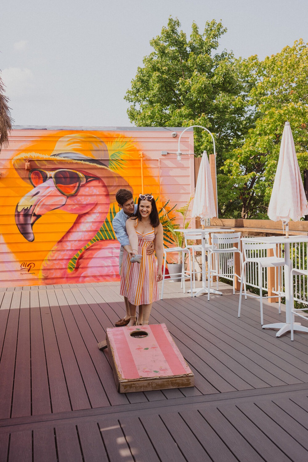 couple playing cornhole 