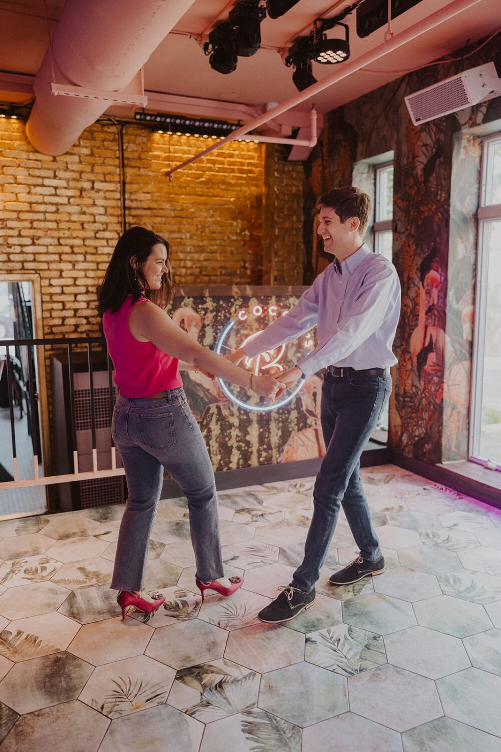 couple dances during engagement shoot