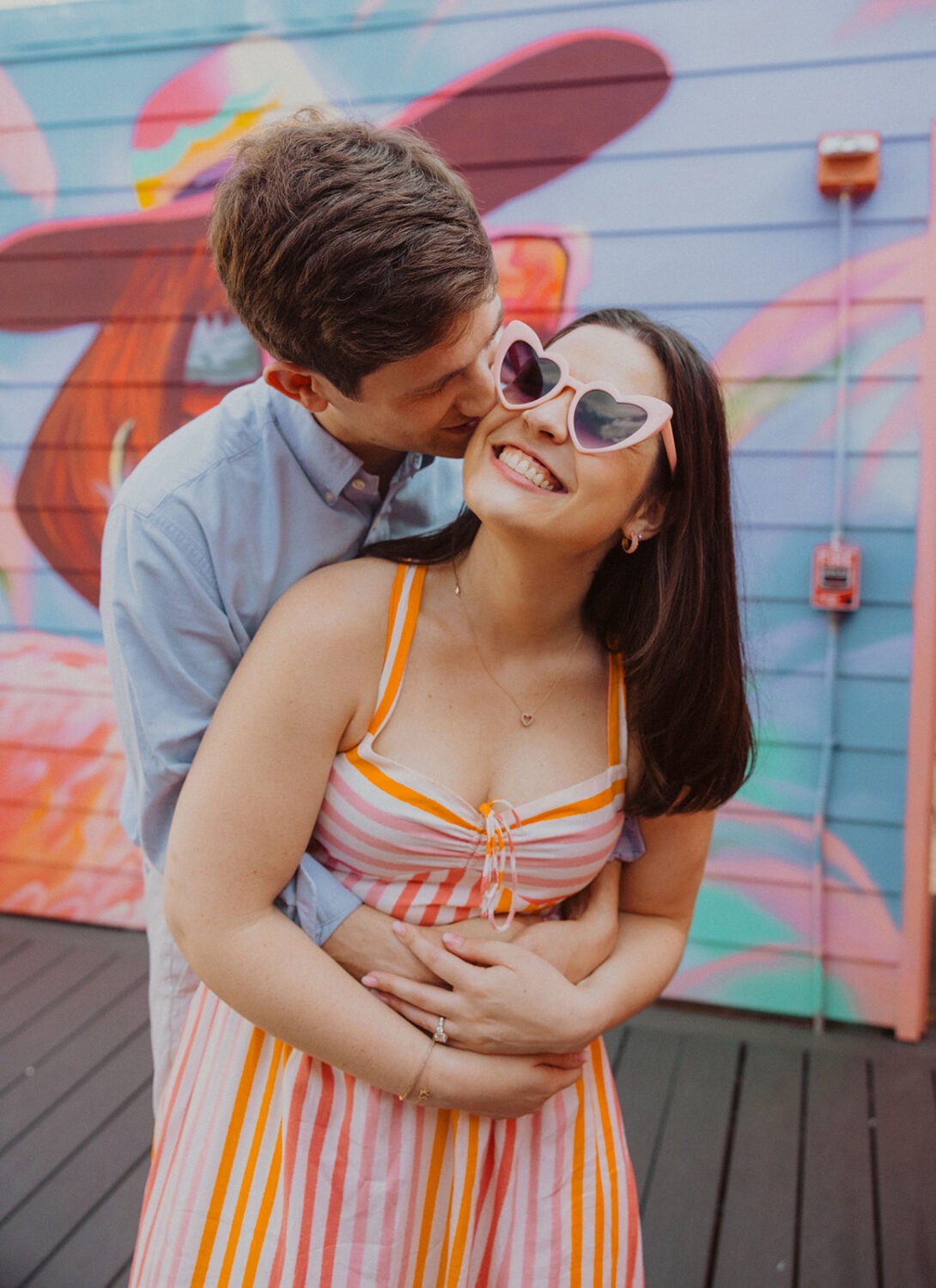 couple embraces during engagement shoot