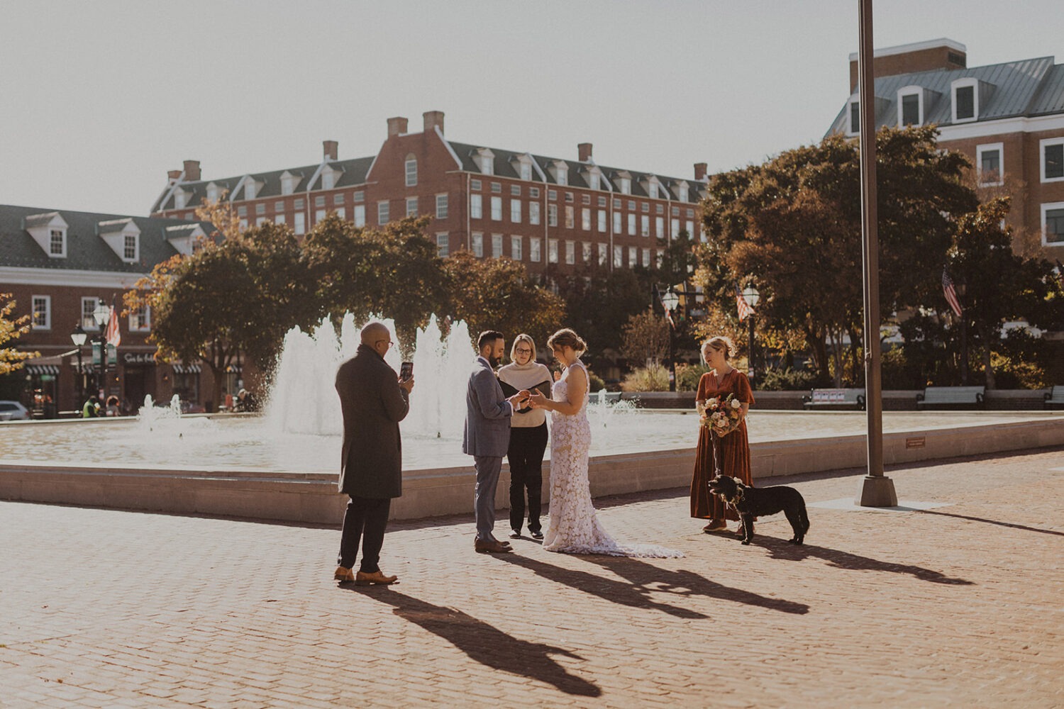 wedding ceremony takes place in front of fountain 