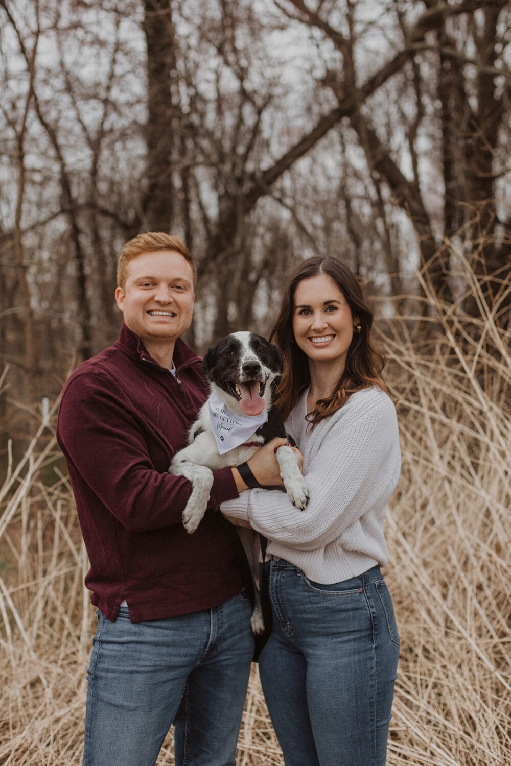 couple posing with their dog during engagement session 