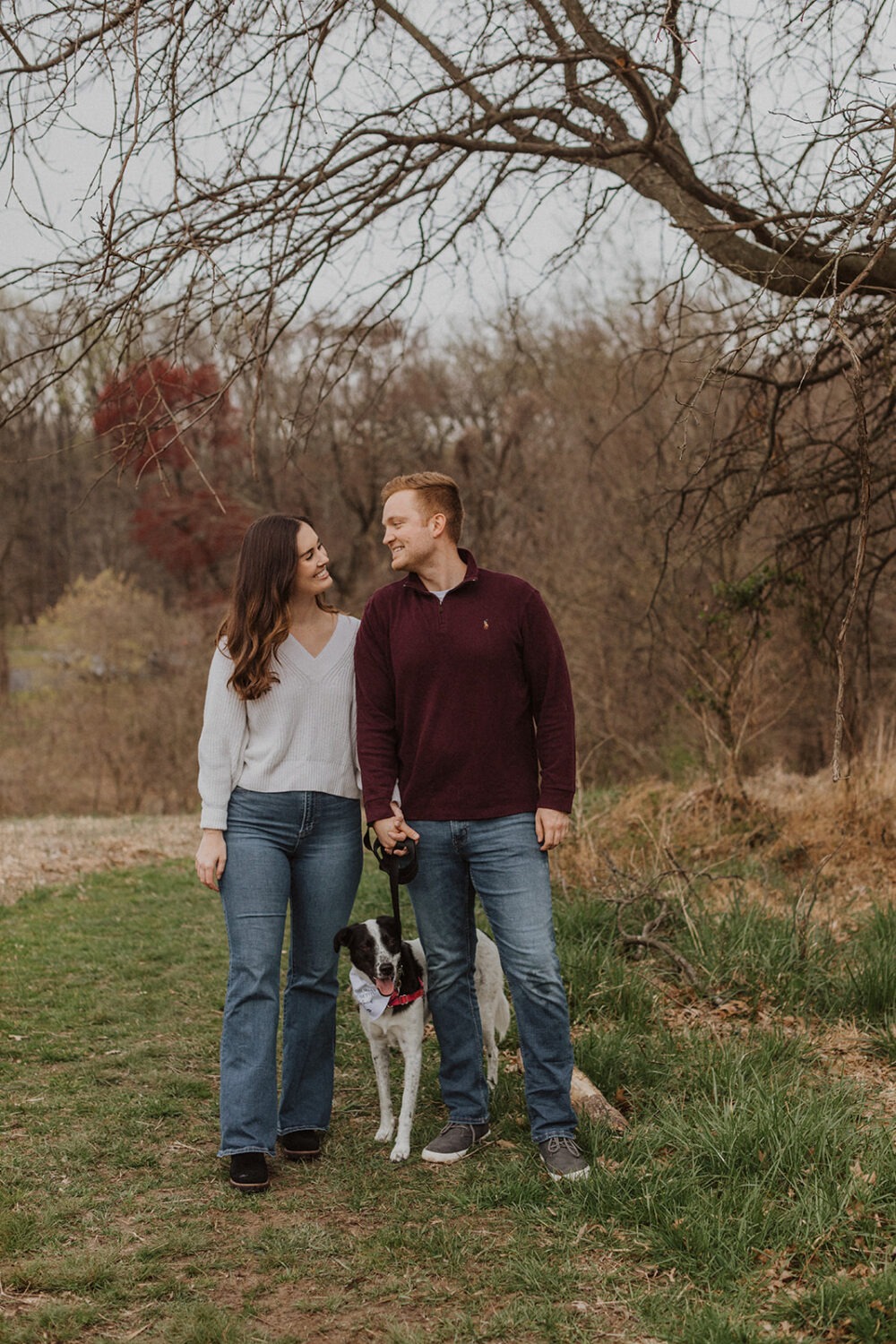 couple posing with their dog during engagement session 
