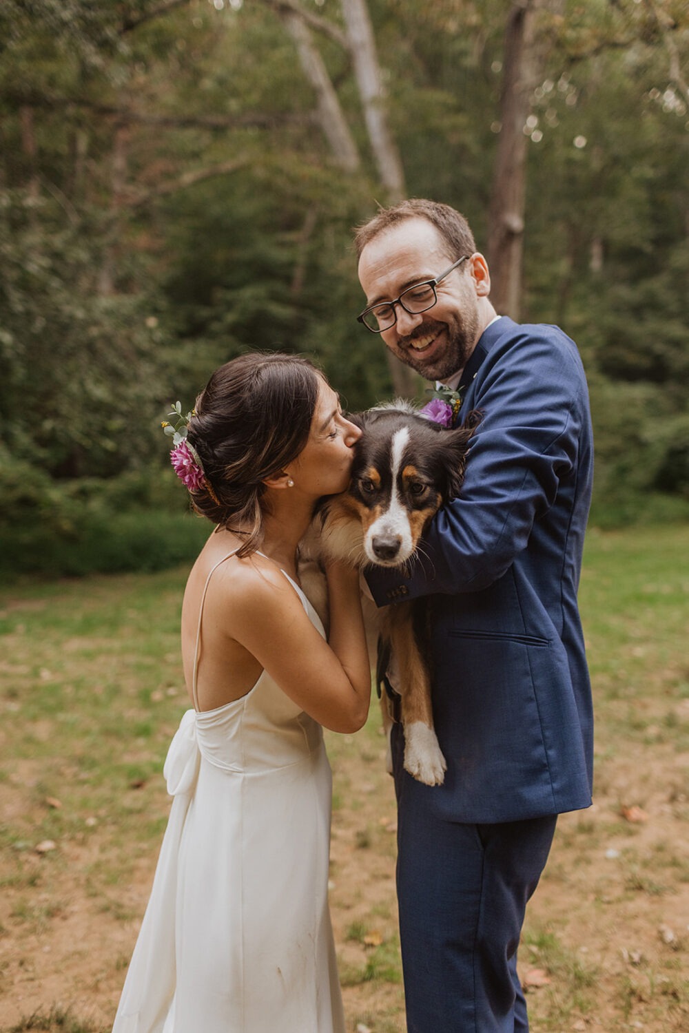 bride kissing dog's face