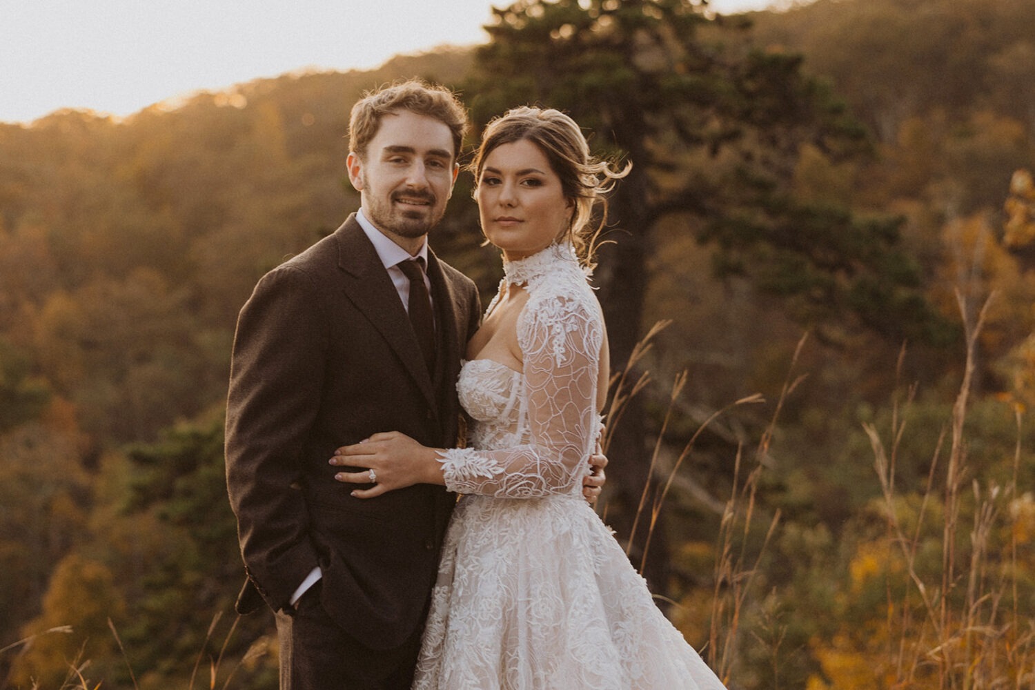 couple pose together in front of mountains in Shenandoah National park