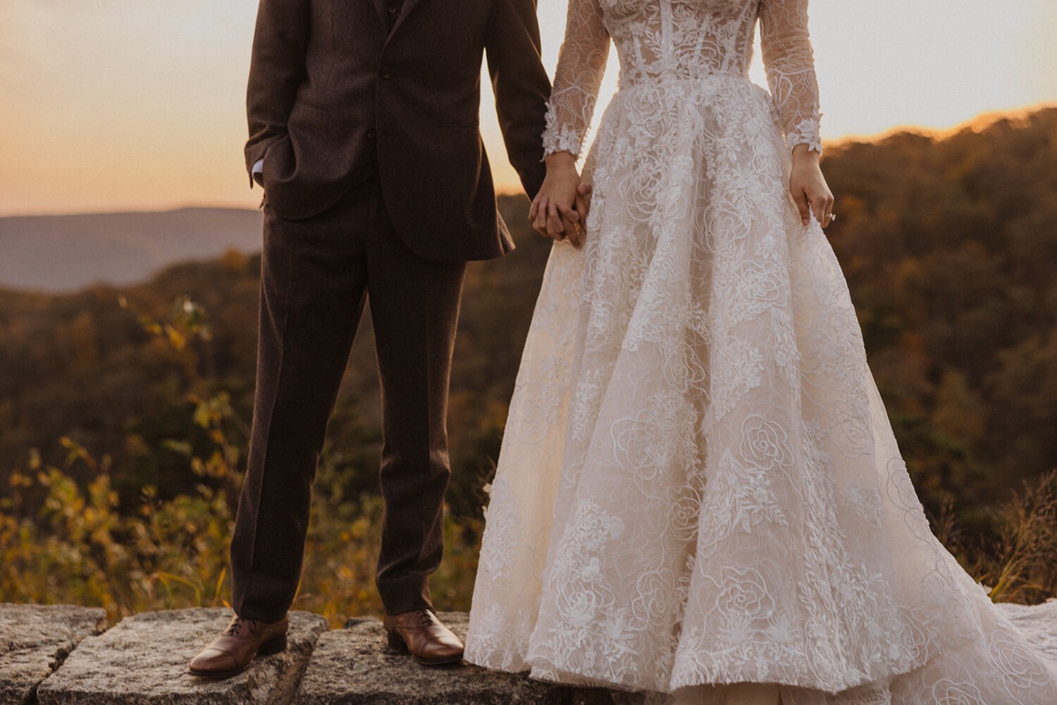 couple pose on ledge at Shenandoah's skyline drive
