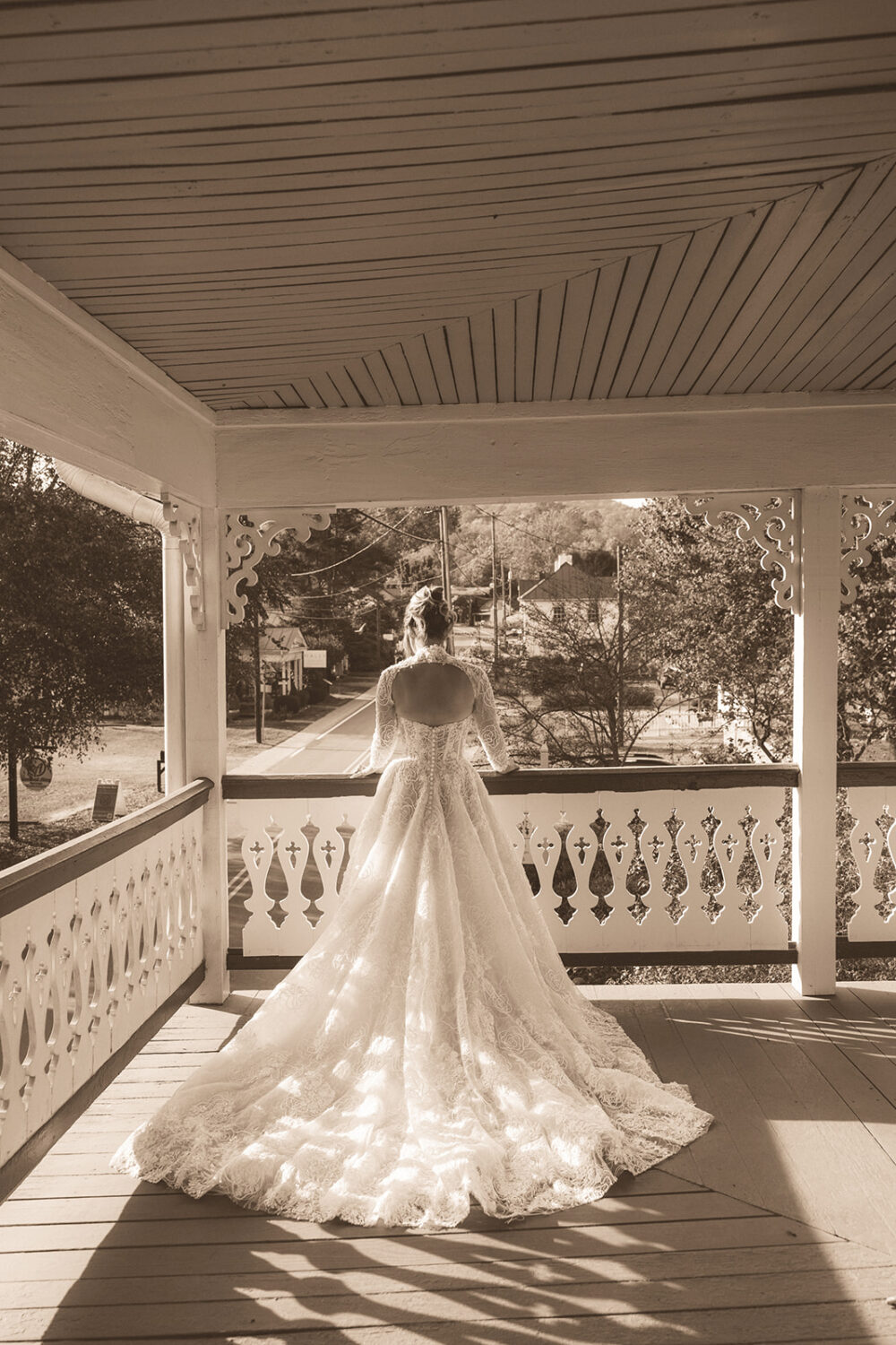 bridal portraits taken on bed and breakfast porch