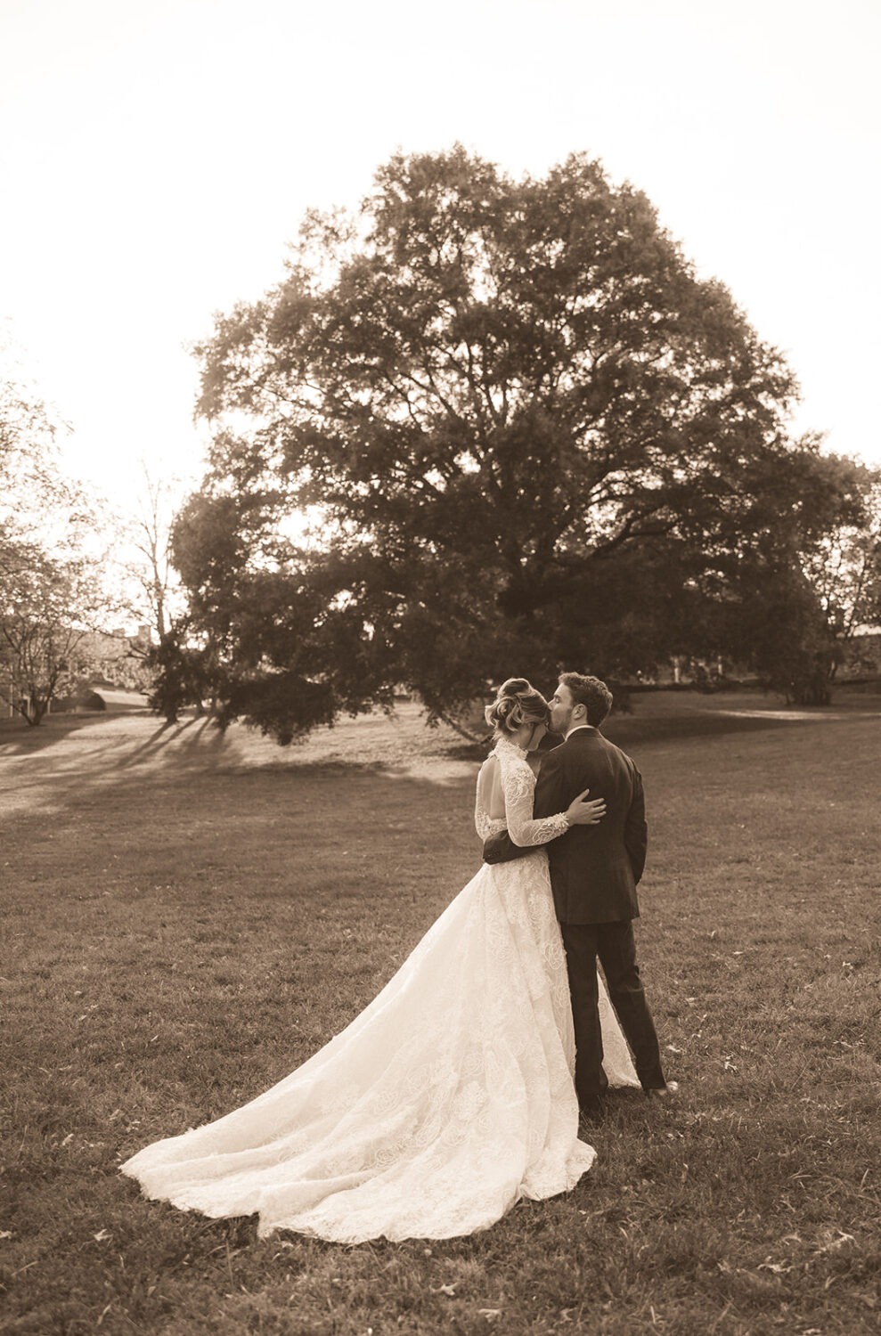 couple kisses during sunset for pre-wedding photos