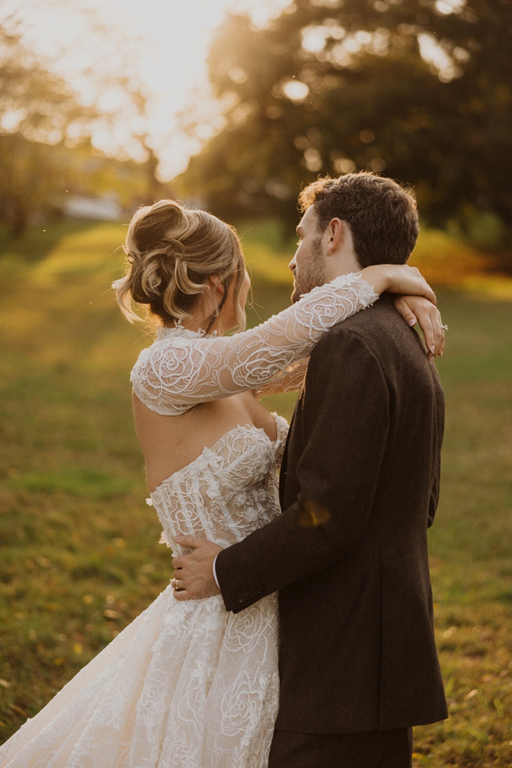 couple embraces during sunset for pre-wedding photos
