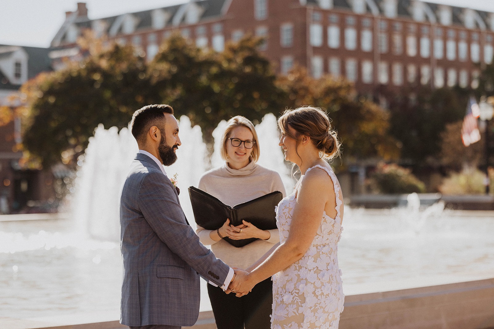 Intimate small wedding ceremony in front of fountain