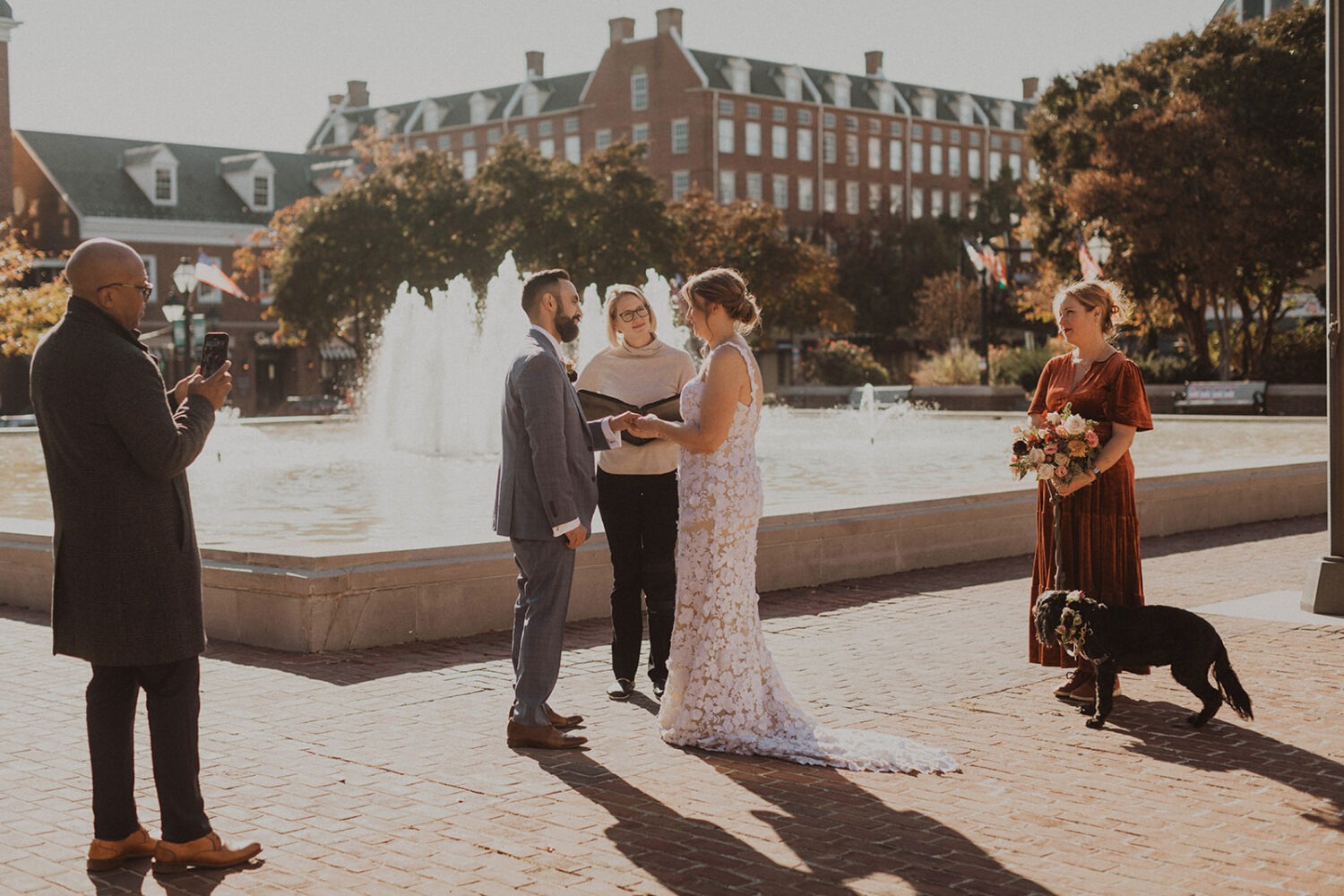 small wedding ceremony held in front of fountain in Old Town Alexandria